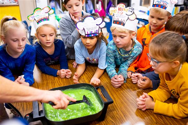 Students learning about Green Eggs and Ham and how to make them. 